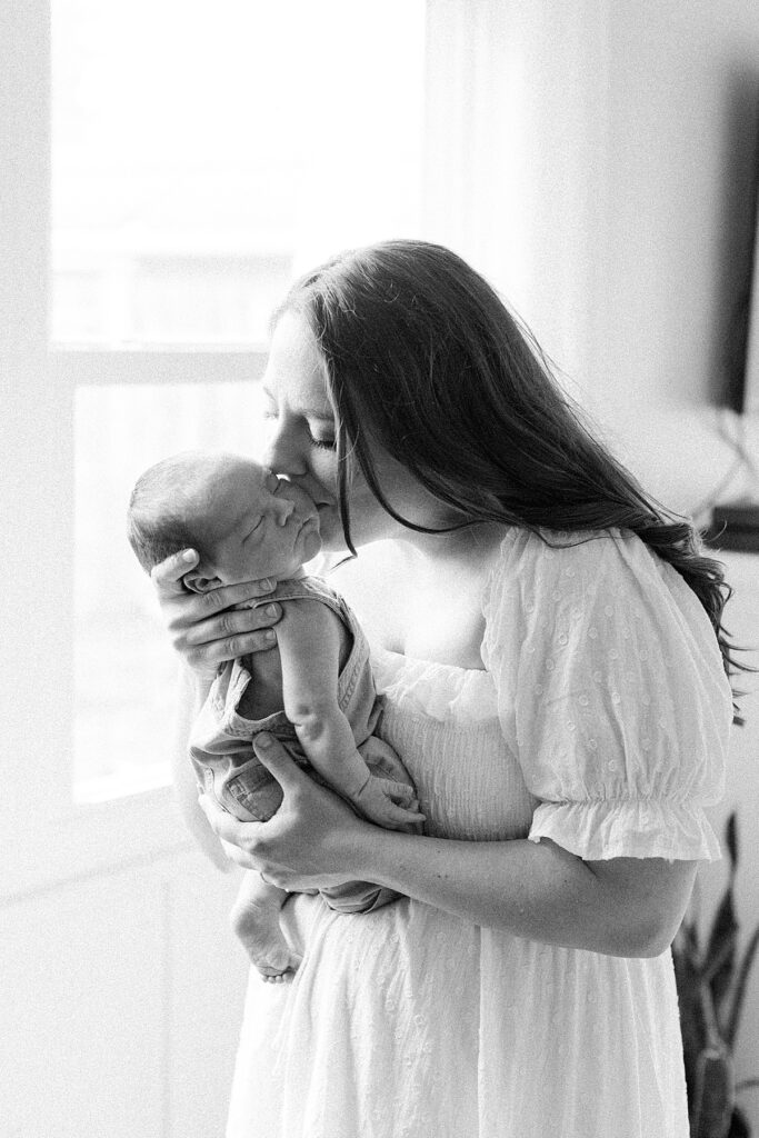 Indianapolis Newborn Photographer Katelyn Ng holds her baby boy