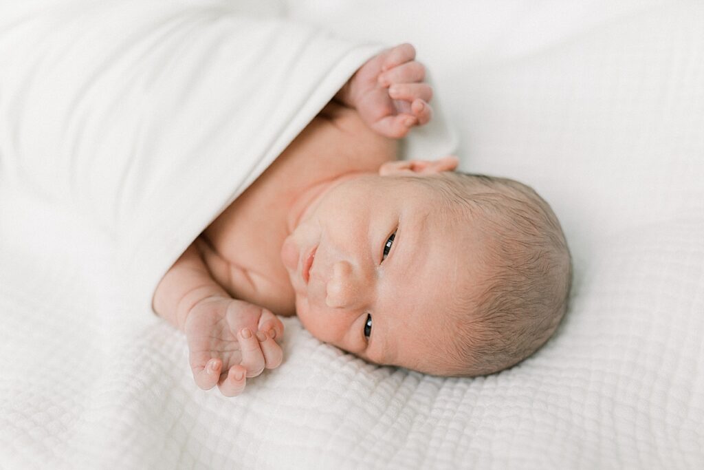 A newborn portrait of a baby boy lying on a blanket in his Indianapolis home.