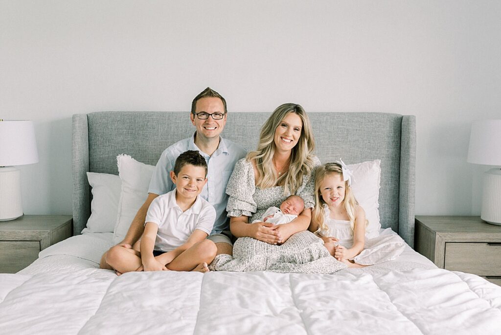 An Indianapolis family poses in their home for a photo by Katelyn Ng Photography 