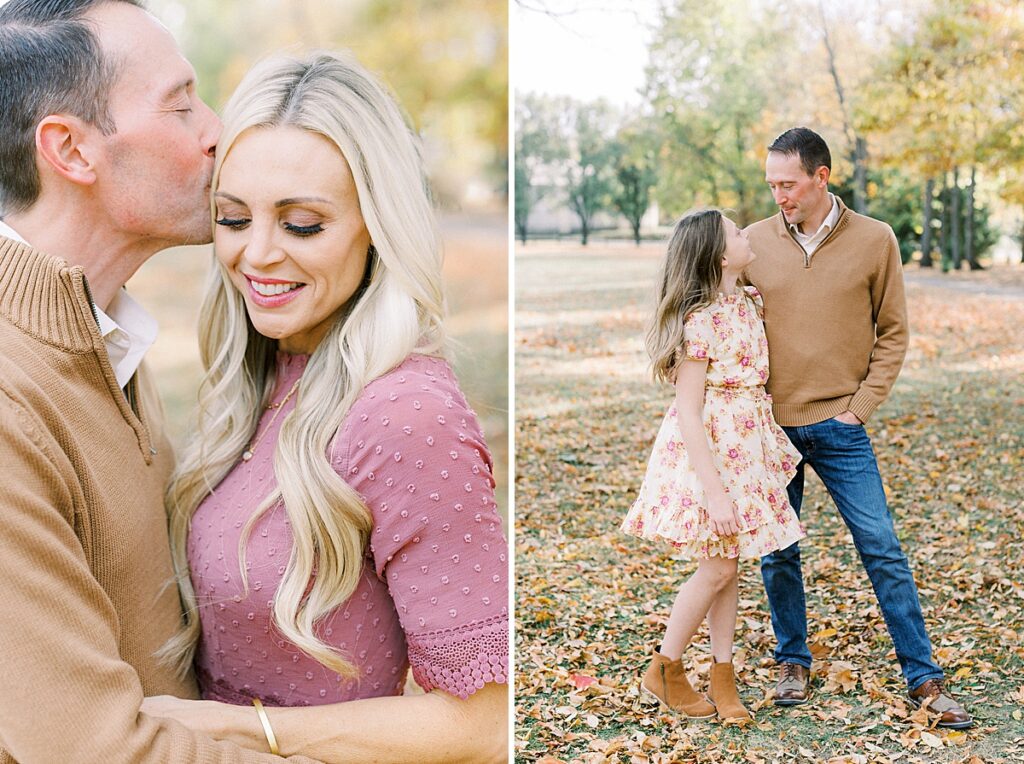 A man dressed in a tan sweater poses with his wife and daughter during family photos.