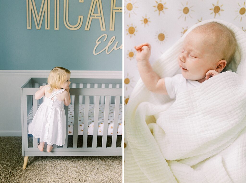A little girl wearing a white dress peeks into the crib during her family's in-home newborn photos by Katelyn Ng Photography.