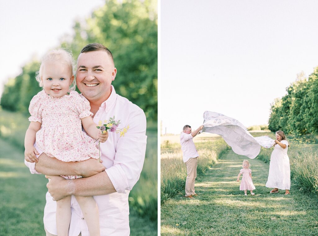 A father poses with his little girl as his family plays in an Indianapolis field during their family photos by Katelyn Ng Photography.