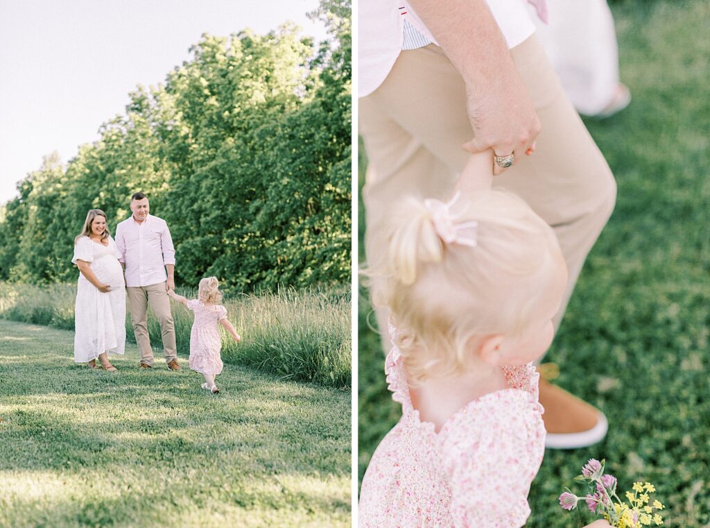 Walking together in a field, a mother and father admire their little girl during their Indianapolis Family Photos with Photographer Katelyn Ng.